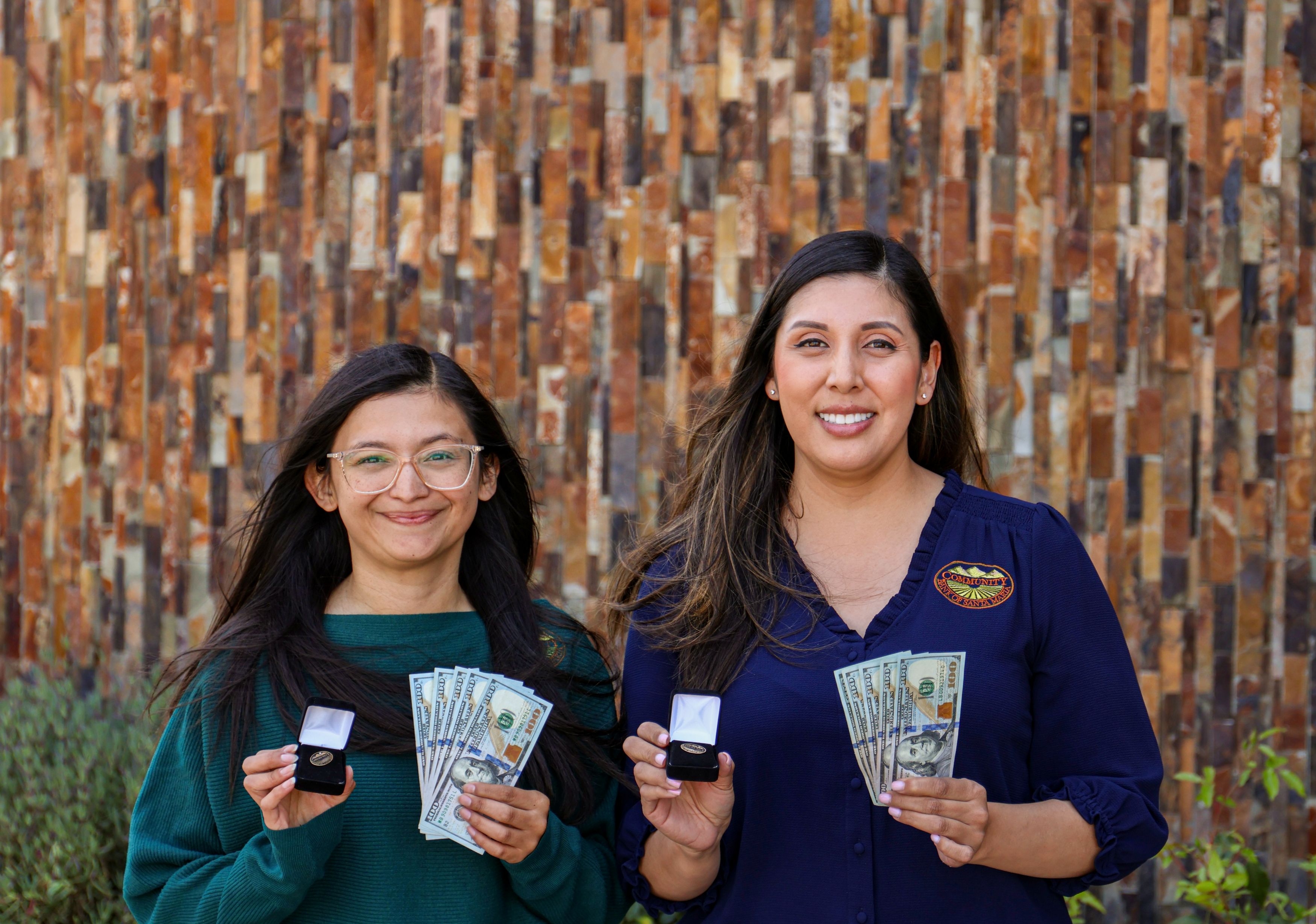 Photo of employees holding various items